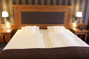 Postel nebo postele na pokoji v ubytování Eden-Hotel