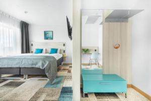 Postel nebo postele na pokoji v ubytování ArenaHotellet i Uppsala