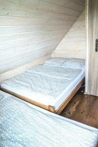 two beds in a sauna in a wooden room at Domki Nadmorska Oaza nad morzem i jeziorem in Jezierzany +45 photos