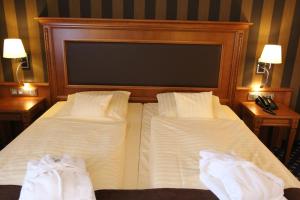 Postel nebo postele na pokoji v ubytování Eden-Hotel