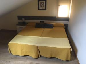 Posteľ alebo postele v izbe v ubytovaní Hostal Doña Juana