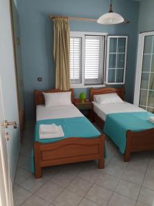Postel nebo postele na pokoji v ubytování Stelios Apartments