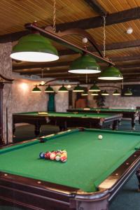 a pool table with balls on top of it at Congress Hotel Forum in Ryazan