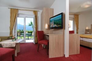 TV a/nebo společenská místnost v ubytování Hotel-Pension Melcher