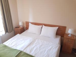 Łóżko lub łóżka w pokoju w obiekcie Villa Nina