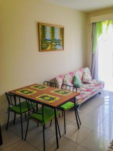 a living room with a table and a couch at Apartment nearby Golden Coast in Protaras