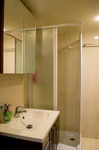 a bathroom with a sink and a shower at Apartment nearby Golden Coast in Protaras