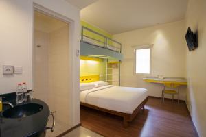 Postel nebo postele na pokoji v ubytování Ibis Budget Jakarta Cikini + 22 fotografií