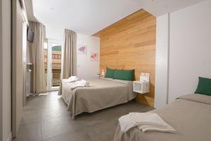 Postel nebo postele na pokoji v ubytování Hotel Degli Olmi