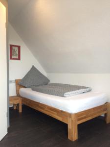 a bed sitting in a room with at FeWo Bettenhausen in Morschen