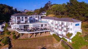an aerial view of a large house on a hill at Biarritz Hotel in St. Brelade