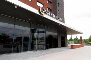 an office building with a sign that reads passion house at Bastion Hotel Eindhoven Waalre in Eindhoven