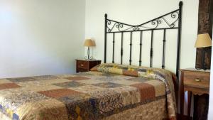 Postel nebo postele na pokoji v ubytování Apartamentos La Huertona