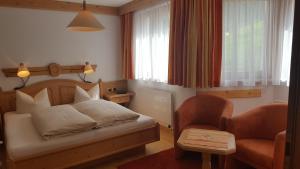 En eller flere senger på et rom på Hotel Camona & Apart Walserhof