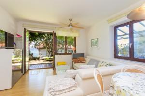 a living room with a couch and a table at Apartments Bojana in Portorož