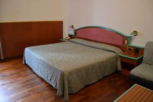 A bed or beds in a room at Hotel ristorante Bellavista