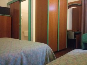 A bed or beds in a room at Hotel ristorante Bellavista