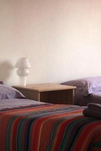 A bed or beds in a room at B&B Villa Dalegno