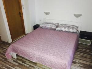 Postel nebo postele na pokoji v ubytování Apartmani Bruna