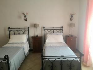 Postel nebo postele na pokoji v ubytování Agriturismo La Ferriera
