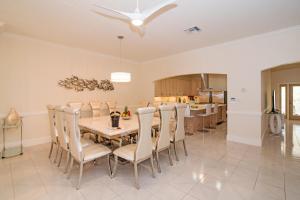 a dining room with a table and chairs at Sprat Bay Luxury Villa in Half Way Pond