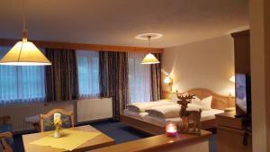 En eller flere senger på et rom på Hotel Camona & Apart Walserhof