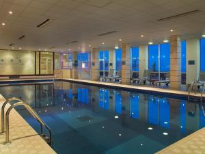 a large swimming pool in a large room at L’Horizon Beach Hotel & Spa in St. Brelade