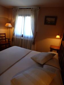 Ένα ή περισσότερα κρεβάτια σε δωμάτιο στο Hotel Areulo