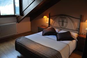 Ένα ή περισσότερα κρεβάτια σε δωμάτιο στο Hotel Areulo