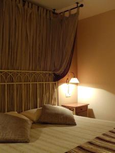 Ένα ή περισσότερα κρεβάτια σε δωμάτιο στο Hotel Areulo