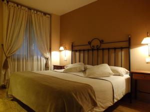 Ένα ή περισσότερα κρεβάτια σε δωμάτιο στο Hotel Areulo