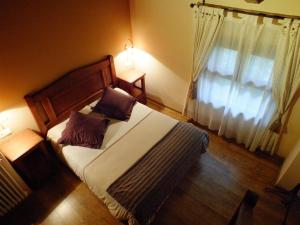 Ένα ή περισσότερα κρεβάτια σε δωμάτιο στο Hotel Areulo