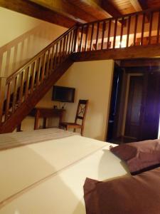 Ένα ή περισσότερα κρεβάτια σε δωμάτιο στο Hotel Areulo