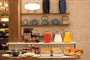 a shelf filled with different types of breakfast foods at Abode Bombay in Mumbai