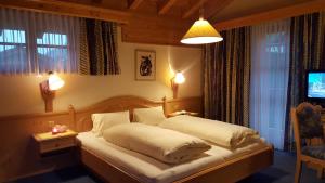 En eller flere senger på et rom på Hotel Camona & Apart Walserhof