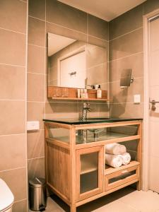 a bathroom with a sink and a mirror at Best Western Plus Antibes Riviera in Antibes