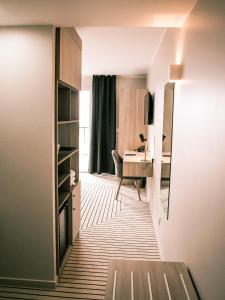 a room with a desk and a computer in it at Best Western Plus Antibes Riviera in Antibes