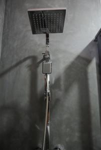 a light on top of a ceiling in a room at First House Mihintale in Mihintale
