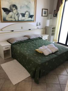 Postel nebo postele na pokoji v ubytování Hotel Byron