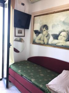 Postel nebo postele na pokoji v ubytování Hotel Byron