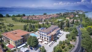 an aerial view of a resort with a large building at Hotel Mirabello in Sirmione