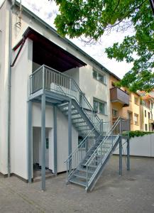 a metal staircase on the side of a building at Appartements Katharina in Bremerhaven
