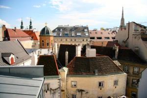 a view of a city with buildings and roofs at Alma Boutique-Hotel in Vienna
