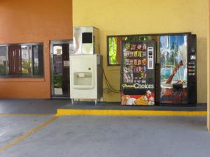 a gas station with a pay phone and a refrigerator at Budget Inn Of Orlando in Orlando