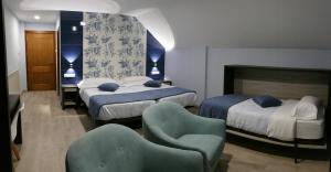 Posteľ alebo postele v izbe v ubytovaní Hotel Rural El Nido de Pinares