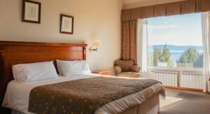 Cama ou camas em um quarto em Terrazas Del Calafate