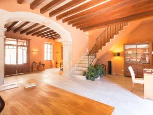 a large living room with a staircase in a building at Ca' n Beia Suites - Adults Only in Alaró