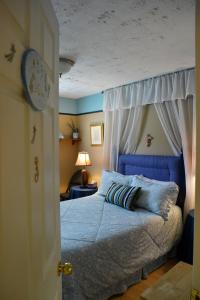 Ένα ή περισσότερα κρεβάτια σε δωμάτιο στο Gîte Marie-Claire