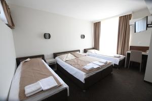 Krevet ili kreveti u jedinici u okviru objekta Atrijum Apartments and Rooms