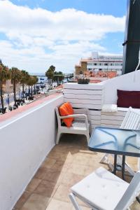 a balcony with a view of the ocean on a building at Cascais Terrace Bay Apartment in Cascais